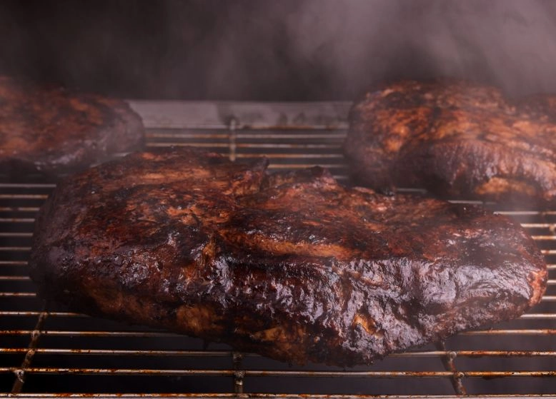 Brisket being smoked.