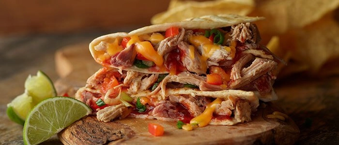 SADLER'S SMOKEHOUSE® pulled pork in a quesadilla with melted cheese.